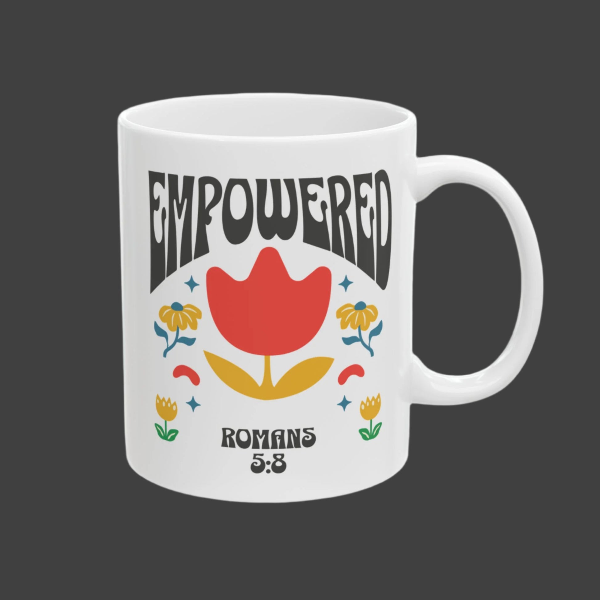 White mug with floral design and 'EMPOWERED' text on a white background