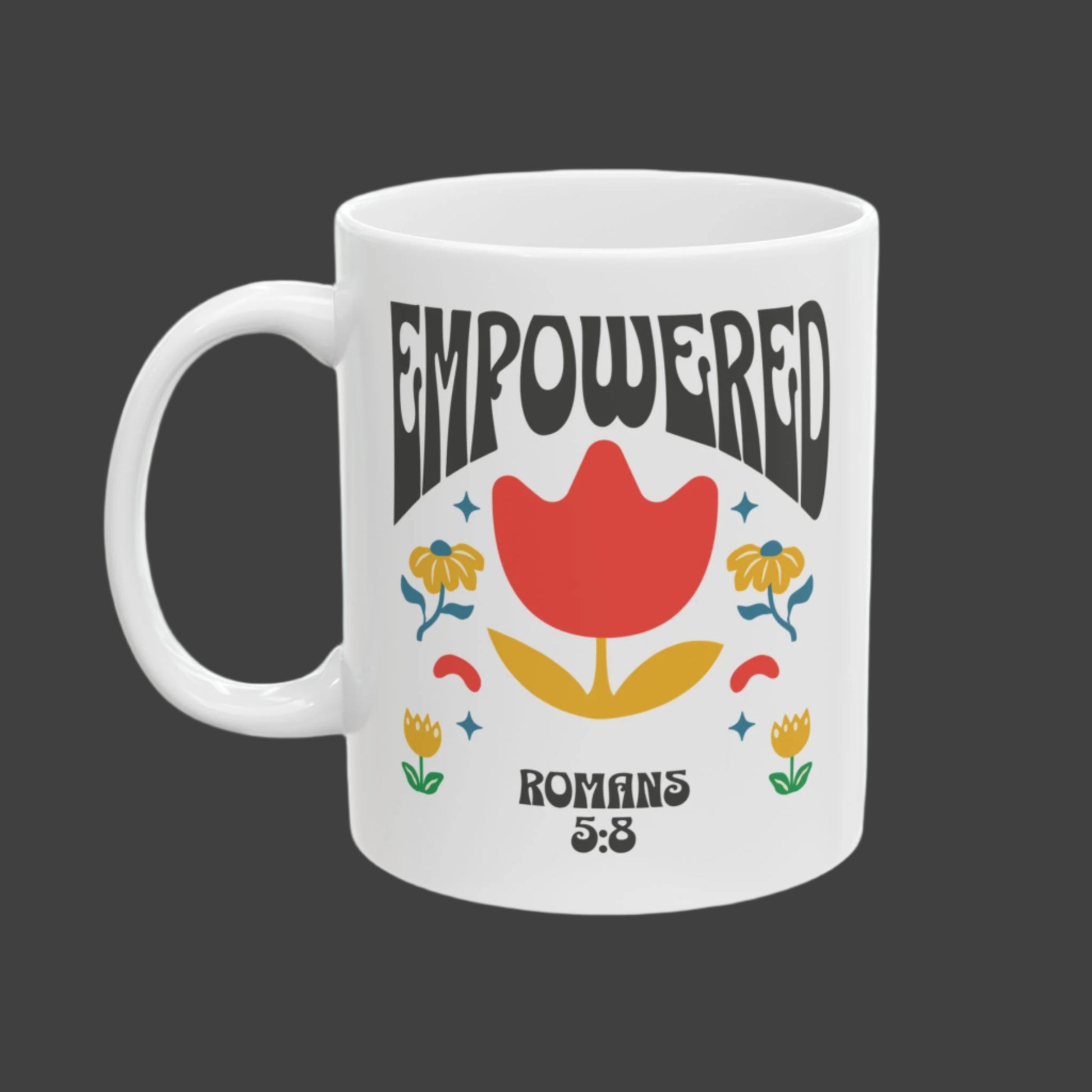 “White ceramic mug with ‘Empowered’ and Romans 5:8 scripture”

“Christian retro floral mug with tulip design and Bible verse”

“Inspirational Romans 5:8 mug about God’s unconditional love”

“Empowerment faith mug for Christian women and believers”

“Dishwasher-safe religious mug with colorful floral artwork”