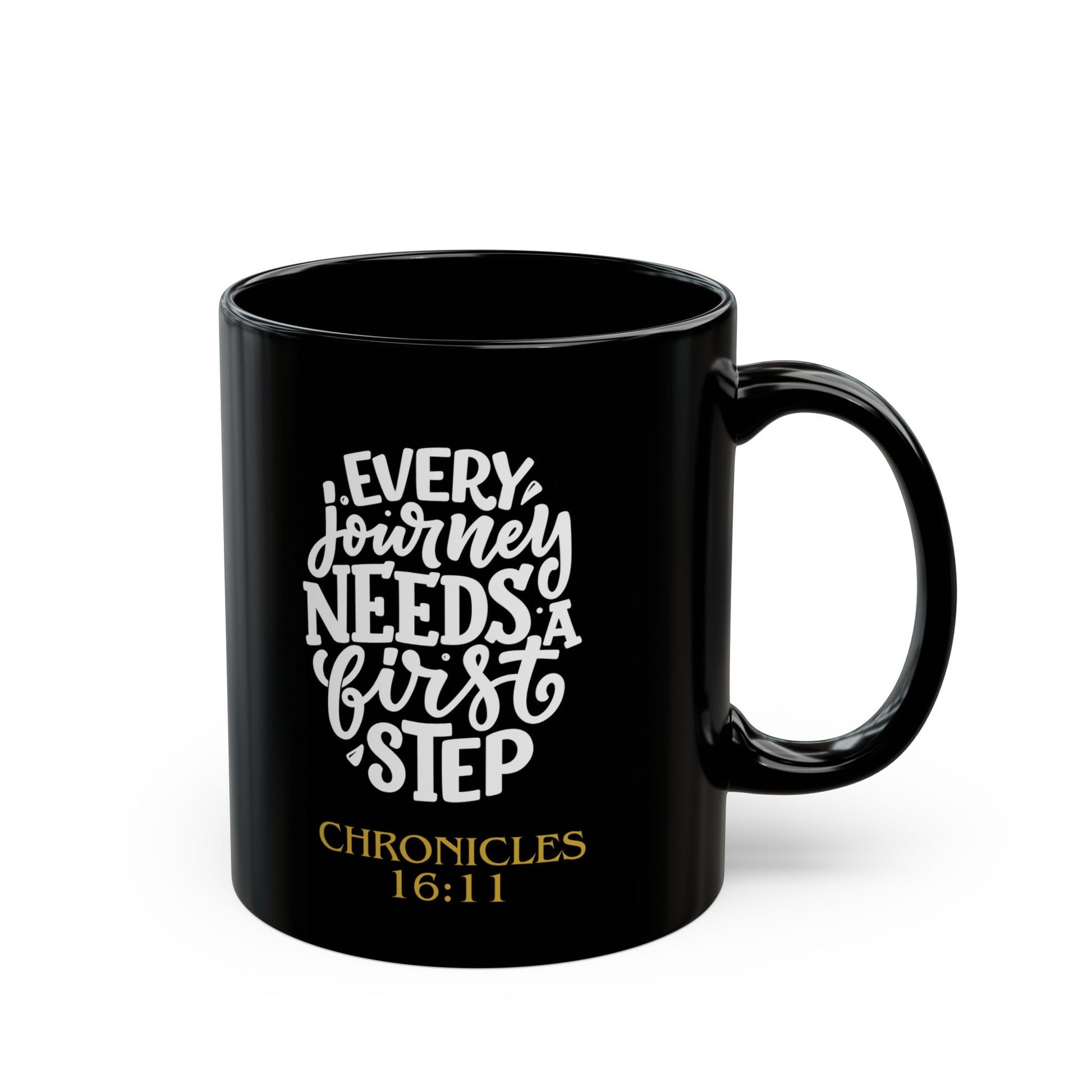 Black mug with motivational quote 'Every journey needs a first step' andbiblical reference on a white background