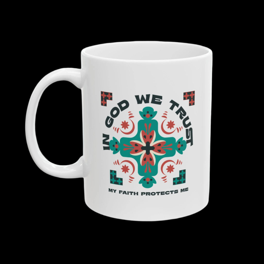 White mug with a design featuring 'In God We Trust' and 'My Faith Protects Me' text on a white background